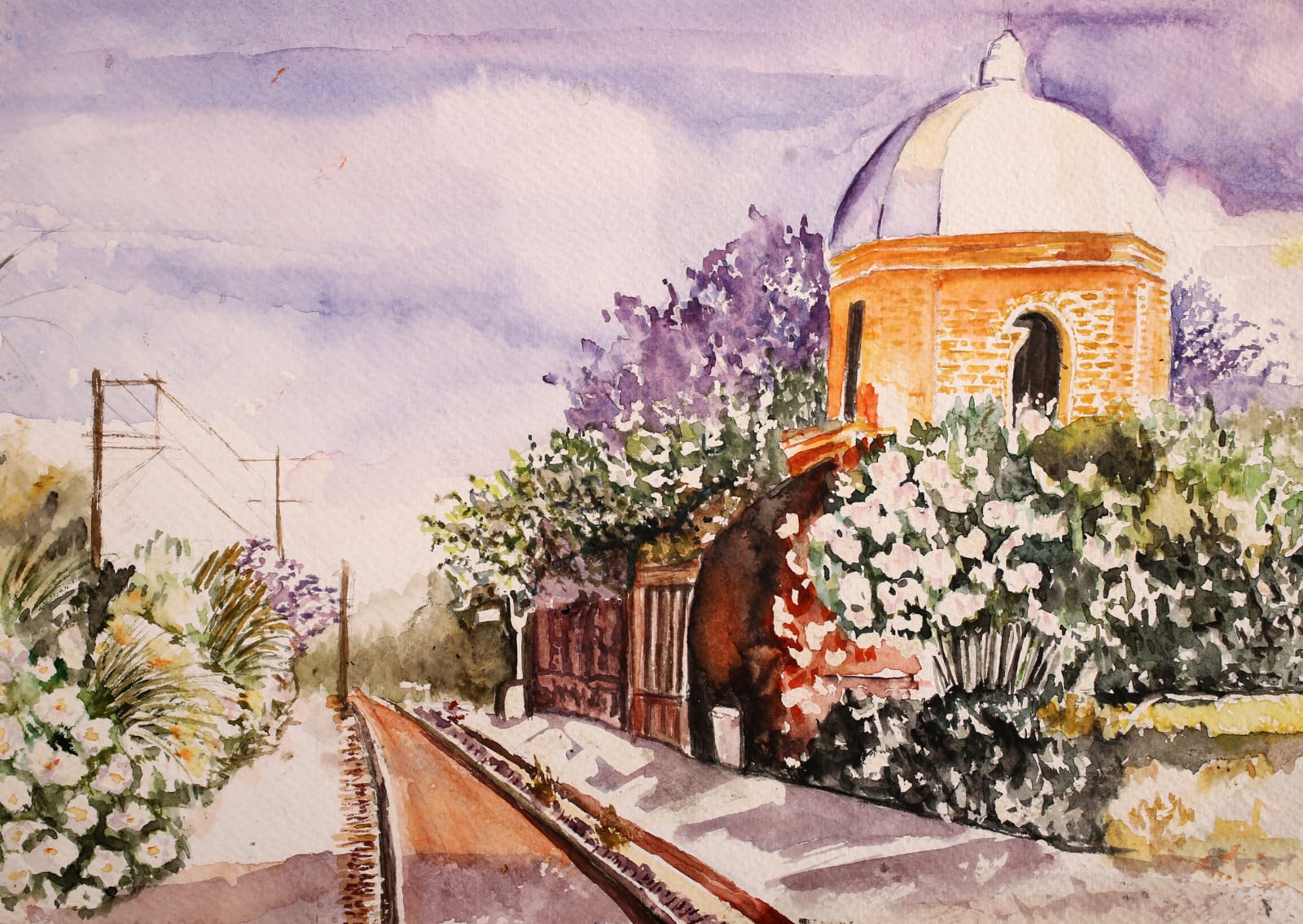 A domed ochre pavilion behind a wall of white blossom and purple jacaranda, beside a railway line under a violet sky.